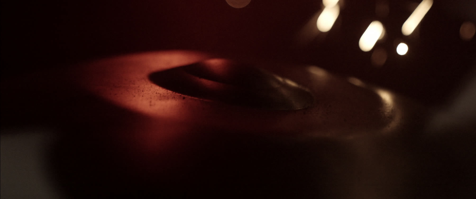 Close-up of an Ember Steel tone field in low red light