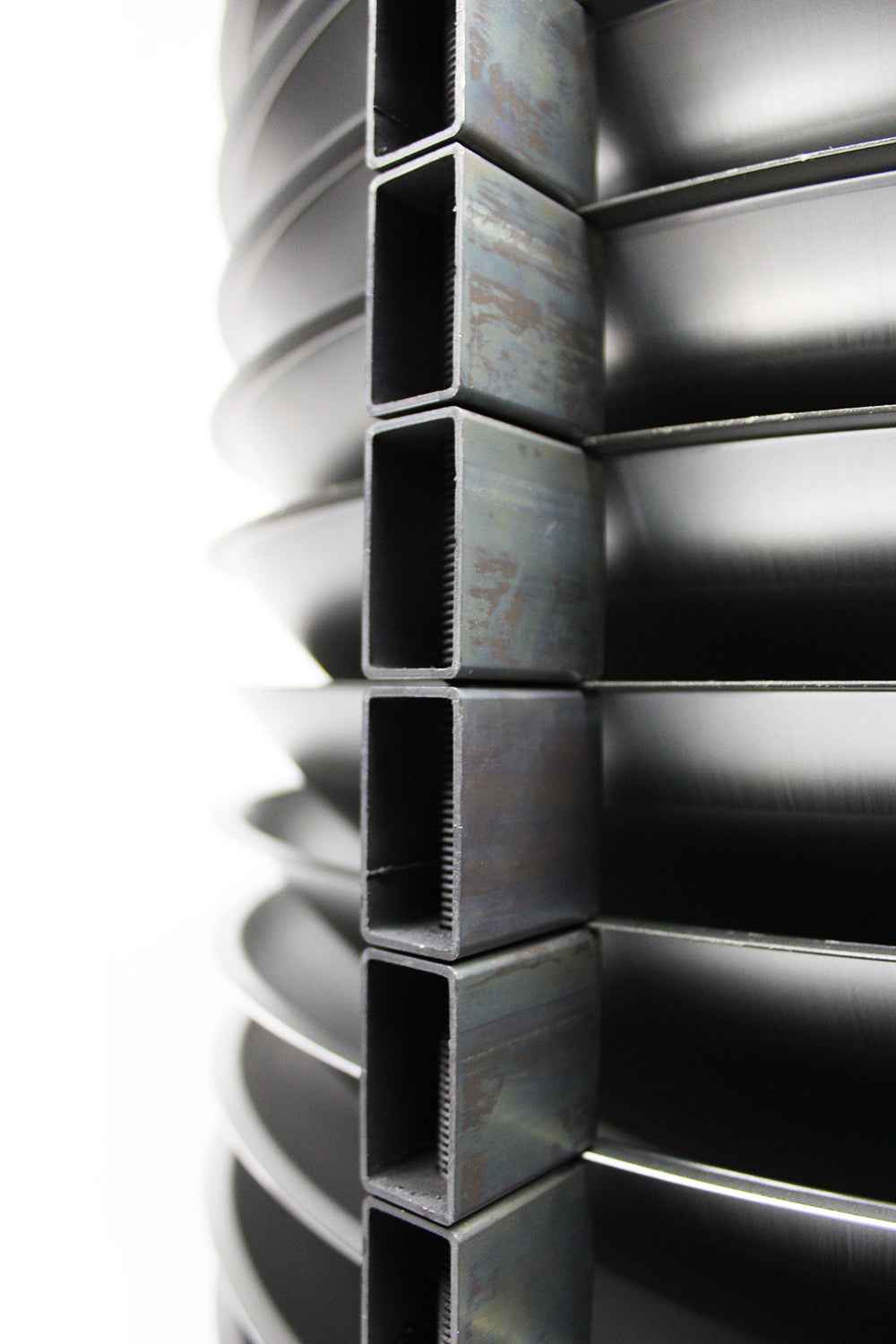 Shells stacked between square steel spacers