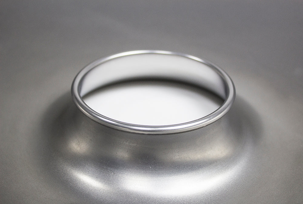 Close-up of the curled collar around a bottom shell's port