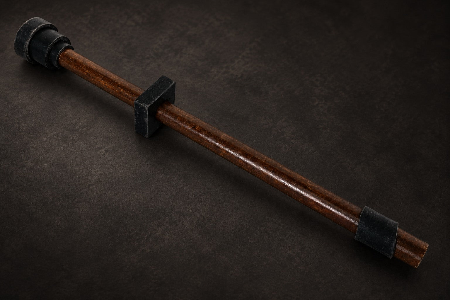 Tuning stick with a rubber square slid over it